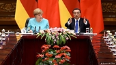 Merkel says China market status resolvable